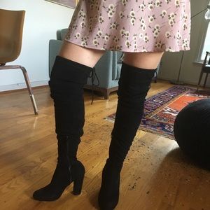 Black thigh high faux suede boots.